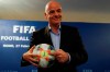 FIFA President Gianni Infantino holds the official ball of the upcoming Women's Soccer World Championship as he poses for photographers during a press conference at the end of an executive committee meeting in Rome, Wednesday, Feb. 27, 2019. (AP Photo/Gregorio Borgia)