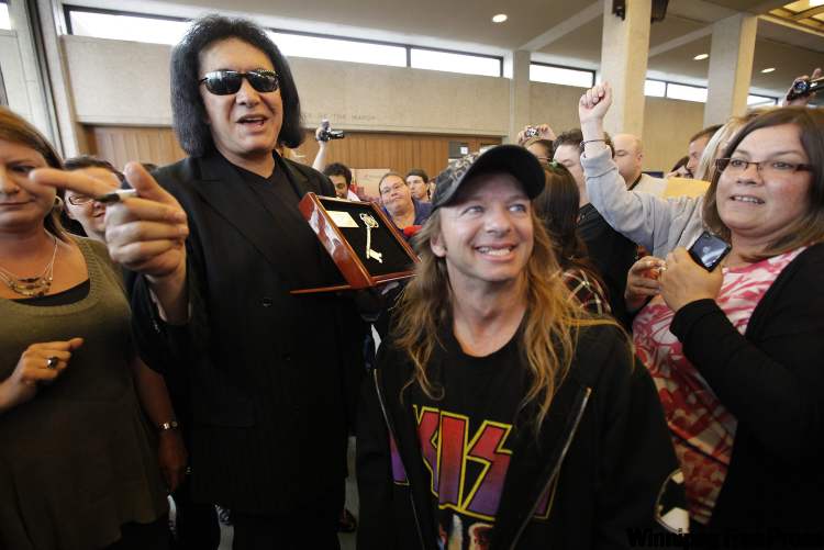 John Woods / The Canadian Press
Gene Simmons meets with fans at Winnipeg's city hall after receiving the Key to the City from deputy mayor Gord Steeves on Wednesday. The KISS frontman is in Winnipeg to speak as part of his Rich & Famous speaking tour.