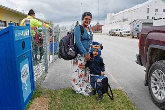 Tessa Vanderhart / Winnipeg Free Press Kettle River Inn & Suites owner Nav Sahota picks up Titan, three, from daycare.