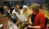 Jason Halstead / Winnipeg Free Press
Kay Tworek (middle) and her daughter, Glenlawn Collegiate community liaison worker Margaret Lapenskie, look at part of the script with cast members Carina McLennan (second left) and Anni Irving (left) during rehearsal on Mon., Nov. 4, 2013, for the Glenlawn Collegiate's Remembrance Day production of Pig Dog,  which is based on Tworek's experiences during the Second World War.