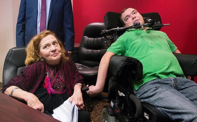 Nicole Gladu, left, and Jean Truchon attend a news conference in Montreal, Thursday, September 12, 2019, where they gave their reaction to a Quebec judge overturning parts of provincial and federal laws on medically assisted dying. THE CANADIAN PRESS/Graham Hughes