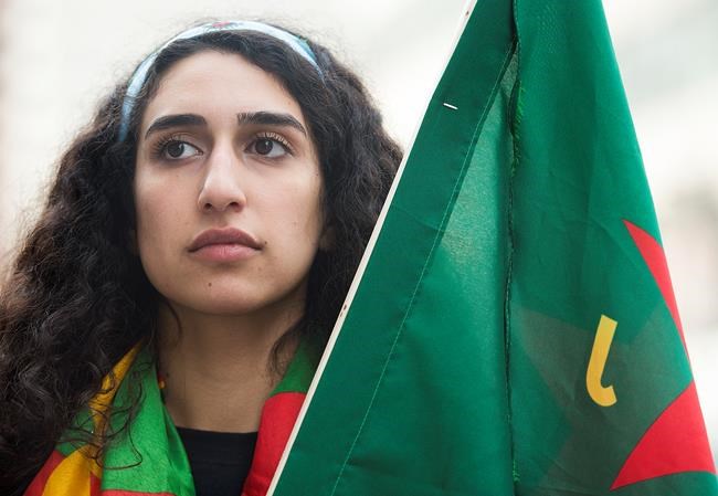 Beritan Oerde, an organizer with the Kurdish Foundation of Quebec poses in Montreal, Saturday, October 12, 2019, following a demonstration against the Turkish invasion into Kurdish held territory in Northern Syria. THE CANADIAN PRESS/Graham Hughes