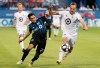 Montreal Impact's Mathieu Choiniere, left, challenges Minnesota United's Brent Kallman during second half MLS soccer action in Montreal, Saturday, July 6, 2019. THE CANADIAN PRESS/Graham Hughes