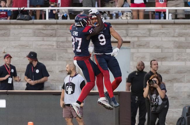 Montreal Alouettes' Jake Wieneke (9) celebrates with teammate Eugene Lewis (87) after scoring a touchdown during second half CFL football action agaisnt the Winnipeg Blue Bombers in Montreal, Saturday, September 21, 2019. THE CANADIAN PRESS/Graham Hughes