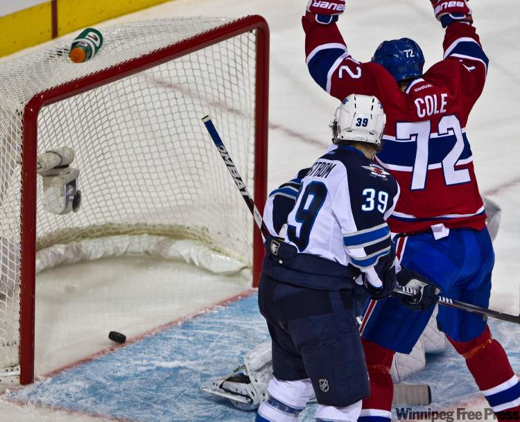 Dave Sidaway / Postmedia News Service
Montreal Canadiens right-winger Erik Cole celebrates a goal by teammate Josh Gorges against Winnipeg Jets goalie Winnipeg Jets goalie Ondrej Pavelec during first-period action in Montreal Wednesday.