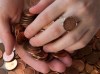Renee Gruszecki displays jewelry she designs from coins at her studio, Coin Coin designs & co., in Halifax on Saturday, Feb. 2, 2013. Many of Gruszecki's personalized creations feature the Canadian one cent coin which has been phased out by the federal government in a cost-saving move. THE CANADIAN PRESS/Andrew Vaughan