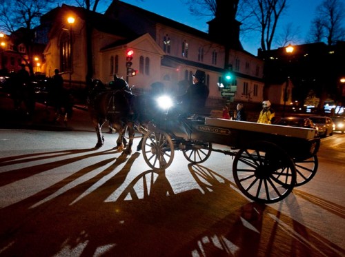 A horse-drawn carriage carries a period-style casket followed by pall bearers through the streets of Halifax to mark the 100th anniversary of the sinking of RMS Titanic on Saturday, April 14, 2011. THE CANADIAN PRESS/Andrew Vaughan