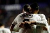 Real forward Karim Benzema celebrates with his teammate Casemiro after scoring his side's opening goal during a Spanish La Liga soccer match at the Ciutat de Valencia stadium in Valencia, Spain, Sunday, Feb. 24, 2019.(AP Photo/Alberto Saiz)