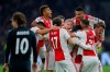 Ajax's Nicolas Tagliafico celebrates with his teammates after scoring his side's opening goal and the goal was disallowed after a review by VAR during the first leg, round of sixteen, Champions League soccer match between Ajax and Real Madrid at the Johan Cruyff ArenA in Amsterdam, Netherlands, Wednesday Feb. 13, 2019. (AP Photo/Peter Dejong)