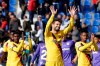 Barcelona's Gerard Pique, center, Barcelona's Ansu Fati, right, and Barcelona's Junior Firpo applaud fans at the end of the Spanish La Liga soccer match between Leganes and FC Barcelona at the Butarque stadium in Madrid, Spain, Saturday Nov. 23, 2019. Barcelona won 2-1. (AP Photo/Paul White)