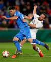 Getafe's Leandro Daniel Cabrera, left, fights for the ball with Real Madrid's Dani Carvajal during a Spanish La Liga soccer match between Getafe and Real Madrid at the Alfonso Perez stadium in Getafe, Spain, Thursday, April 25, 2019. (AP Photo/Bernat Armangue)