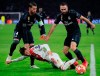 Ajax's Nicolas Tagliafico, center, is tackled by Real defender Dani Carvajal, right, and Real defender Sergio Ramos during the first leg, round of sixteen, Champions League soccer match between Ajax and Real Madrid at the Johan Cruyff ArenA in Amsterdam, Netherlands, Wednesday Feb. 13, 2019. (AP Photo/Peter Dejong)