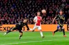 Juventus' Cristiano Ronaldo, left, scores his side's opening goal during the Champions League quarterfinal, first leg, soccer match between Ajax and Juventus at the Johan Cruyff ArenA in Amsterdam, Netherlands, Wednesday, April 10, 2019. (AP Photo/Martin Meissner)