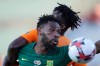 South Africa's Thulani Hlatshwayo, foreground, fights for the ball with Ivory Coast's Franck Yannick jessie during the African Cup of Nations group D soccer match between Ivory Coast and South Africa in Al Salam Stadium in Cairo, Egypt, Monday, June 24, 2019. (AP Photo/Hassan Ammar)