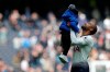 Tottenham's Lucas Moura hugs his son end of the English Premier League soccer match between Tottenham Hotspur and Huddersfield Town at Tottenham Hotspur stadium in London, Saturday, April 13, 2019.(AP Photo/Frank Augstein)