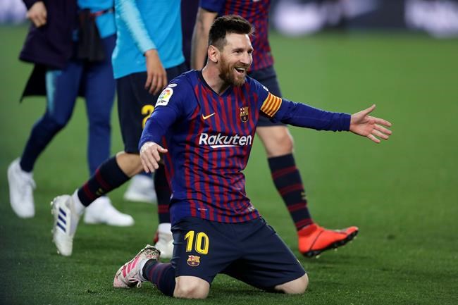 Barcelona forward Lionel Messi celebrates winning the Spanish League title, at the end of the Spanish La Liga soccer match between FC Barcelona and Levante at the Camp Nou stadium in Barcelona, Spain, Saturday, April 27, 2019. Barcelona clinched the Spanish La Liga title, with three matches to spare, after it defeated Levante 1-0. (AP Photo/Manu Fernandez)