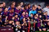 FC Barcelona players, with their children, pose with their trophy after winning the Spanish League title, at the end of the Spanish La Liga soccer match between FC Barcelona and Levante at the Camp Nou stadium in Barcelona, Spain, Saturday, April 27, 2019. Barcelona clinched the Spanish La Liga title, with three matches to spare, after it defeated Levante 1-0. (AP Photo/Manu Fernandez)