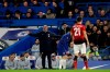 Chelsea head coach Maurizio Sarri, left, reacts after Chelsea's Eden Hazard is fouled by Manchester United's Nemenja Matic during the English FA Cup fifth round soccer match between Chelsea and Manchester United at Stamford Bridge stadium in London, Monday, Feb. 18, 2019. (AP Photo/Matt Dunham)