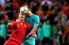 Portugal's Cristiano Ronaldo, left, jumps for the ball with Netherlands' Matthijs de Ligt during the UEFA Nations League final soccer match between Portugal and Netherlands at the Dragao stadium in Porto, Portugal, Sunday, June 9, 2019. (AP Photo/Martin Meissner)
