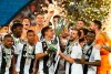 Juventus' Paulo Dybala, center left, and Juventus' Miralem Pjanic raise the trophy at the end of the Italian Super Cup final soccer match between AC Milan and Juventus at King Abdullah stadium in Jiddah, Saudi Arabia, Wednesday, Jan. 16, 2019. (AP Photo)