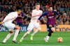 Barcelona forward Lionel Messi, right, runs with the ball past Manchester United's Scott McTominay, center, and Manchester United's Chris Smalling during the Champions League quarterfinal, second leg, soccer match between FC Barcelona and Manchester United at the Camp Nou stadium in Barcelona, Spain, Tuesday, April 16, 2019. (AP Photo/Joan Monfort)
