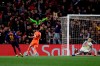 Barcelona forward Ousmane Dembele, left, scores his side's fifth goal during the Champions League round of 16, 2nd leg, soccer match between FC Barcelona and Olympique Lyon at the Camp Nou stadium in Barcelona, Spain, Wednesday, March 13, 2019. (AP Photo/Manu Fernandez)
