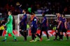 Barcelona defender Gerard Pique, second left, applauds fans at the end of the Champions League round of 16, 2nd leg, soccer match between FC Barcelona and Olympique Lyon at the Camp Nou stadium in Barcelona, Spain, Wednesday, March 13, 2019. (AP Photo/Manu Fernandez)