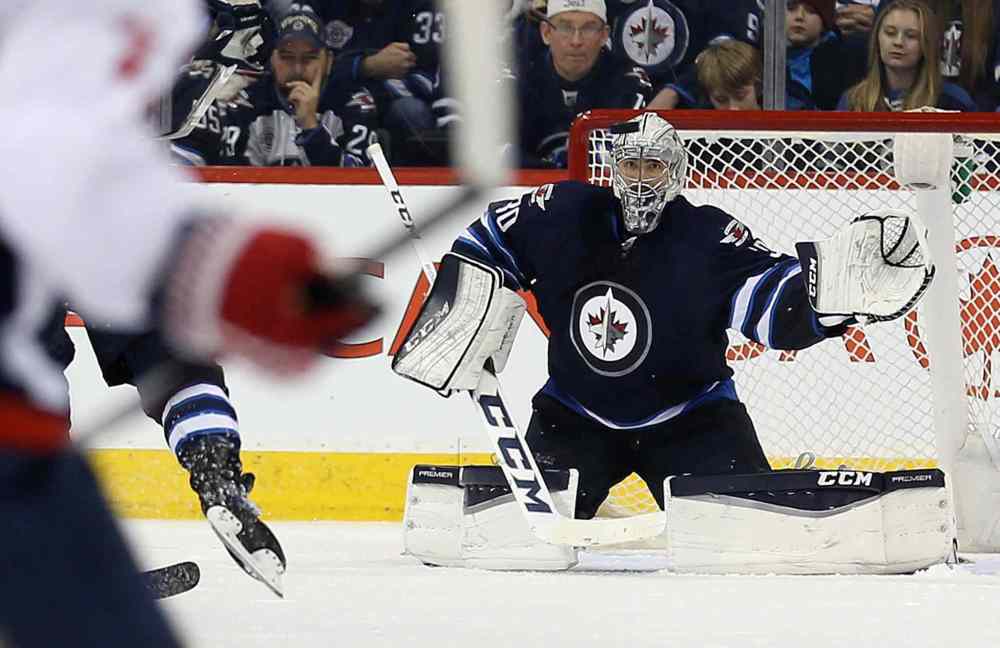 TREVOR HAGAN / WINNIPEG FREE PRESS
Winnipeg Jets' goaltender Connor Hellebuyck is a perfect 3-0 this season with wins over Minnesota (3-1), Toronto (6-1) and, most recently, a 2-1 overtime victory against Washington on Saturday.