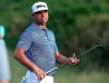 Gary Woodland reacts to missing his birdie putt to force a playoff during the final round of the Tournament of Champions golf event, Sunday, Jan. 6, 2019, at Kapalua Plantation Course in Kapalua, Hawaii. Woodland finished in second place. (AP Photo/Matt York)