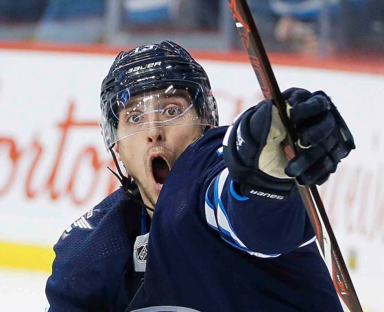 CPWinnipeg Jets' Brandon Tanev (13) celebrates after scoring during second period NHL action against the Tampa Bay Lightning, in Winnipeg on Sunday, Dec. 16, 2018. THE CANADIAN PRESS/John Woods