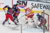 CP
Calgary Flames' Matthew Tkachuk puts pressure on Winnipeg Jets goaltender Connor Hellebuyck as Jets right wing Patrik Laine (29) and defenceman Josh Morrissey defend. (Matt Smith / The Canadian Press)