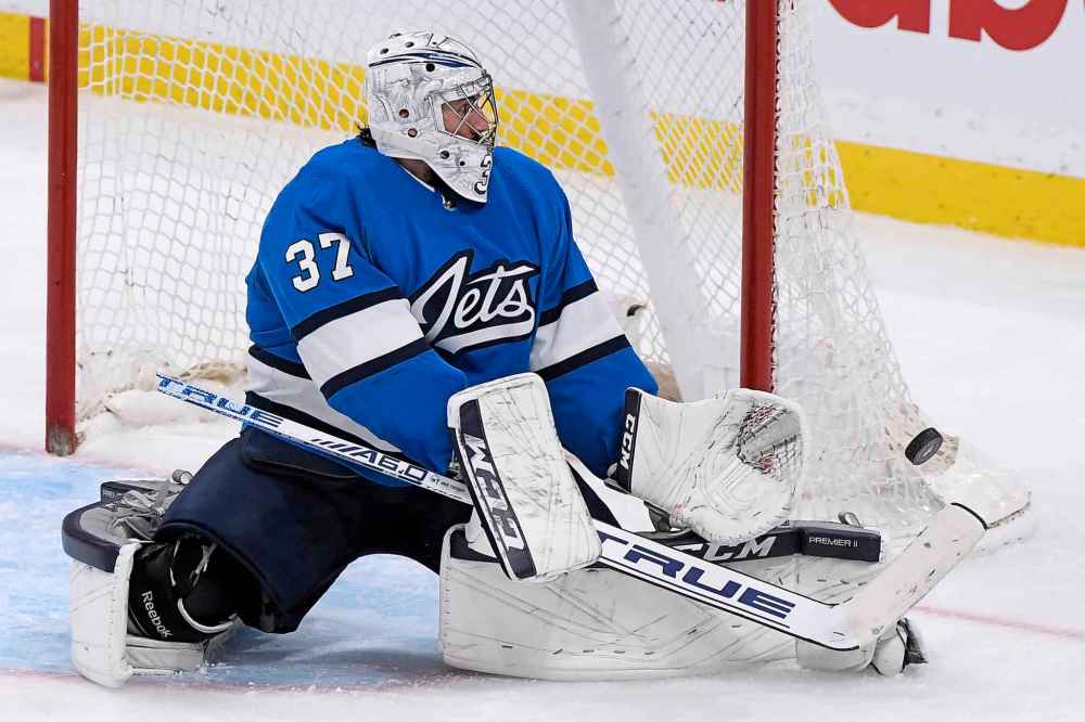 CP
Winnipeg Jets' goaltender Connor Hellebuyck (37) makes a save on a Dallas Stars shot during third period NHL action in Winnipeg on Sunday, Nov. 10, 2019. (Fred Greenslade / Canadian Press)