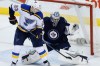 JOHN WOODS / THE CANADIAN PRESS 
Winnipeg Jets goaltender Ondrej Pavelec (31) saves the shot from the point as St. Louis Blues' Dmitrij Jaskin (23) looks for the rebound during the first period in Winnipeg Thursday.