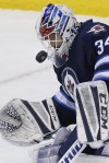 JOHN WOODS / THE CANADIAN PRESS
Winnipeg Jets goaltender Michael Hutchinson (34) keeps a close eye on the puck as he saves the Columbus Blue Jackets' shot off his mask.
