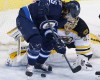 CP
Winnipeg Jets' Mathieu Perreault (85) attempts the backhander against Boston Bruins goaltender Tuukka Rask (40) during first period NHL action in Winnipeg on Friday.