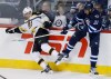 CP
Winnipeg Jets' Dustin Byfuglien (33) checks Boston Bruins' Daniel Paille (20) during first period NHL action in Winnipeg on Friday.