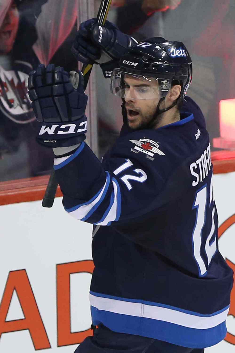 THE CANADIAN PRESS/John Woods
Winnipeg Jets' Drew Stafford (12) celebrates his goal against Columbus Blue Jackets during third period NHL action, in Winnipeg, on Thursday, Dec. 10, 2015.