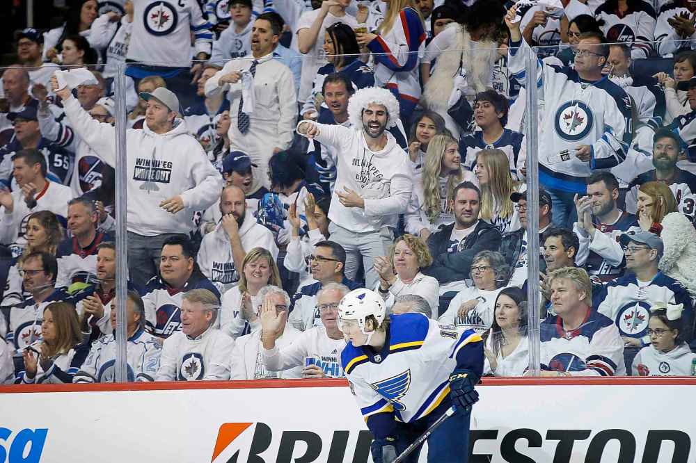 Jets fans did their part on Wednesday, dressing in white and heckling St. Louis Blues' players every chance they could. (John Woods / The Canadian Press)