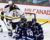 John Woods / The Canadian Press
Boston Bruins goaltender Tuukka Rask (40) and Zdeno Chara (33) talk as the Winnipeg Jets celebrate after Nikolaj Ehlers scored during the first period.