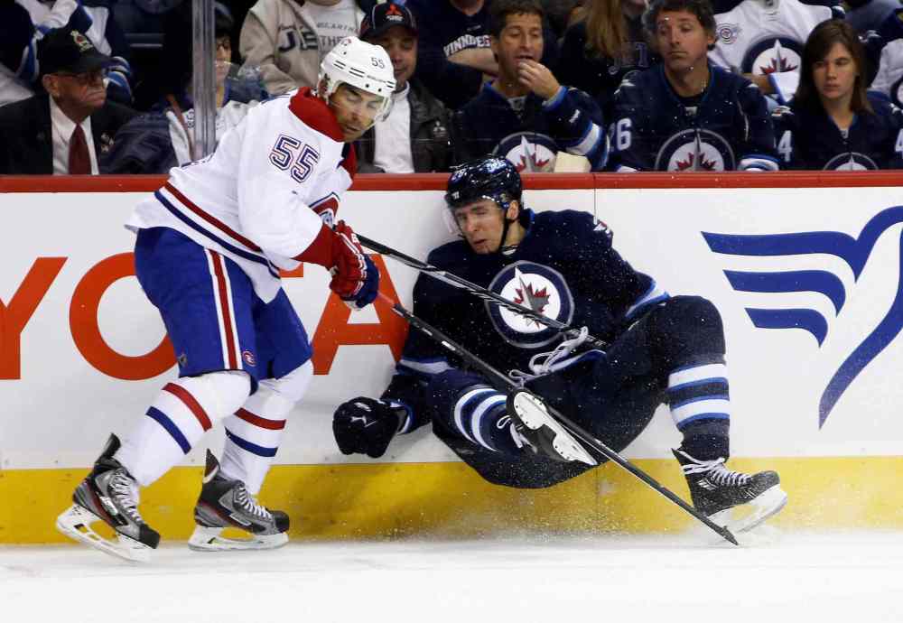 JOHN WOODS / WINNIPEG FREE PRESS
Montreal Canadiens' Francis Bouillon checks Winnipeg Jets' Blake Wheeler during second-period NHL action at the MTS Centre in Winnipeg Tuesday.