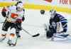 CP
Winnipeg Jets goaltender Michael Hutchinson (34) saves the deflection by Calgary Flames' Markus Granlund (60) during third period of NHL pre-season game action in Winnipeg on Thursday, October 1, 2015. THE CANADIAN PRESS/John Woods