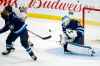 FRED GREENSLADE / THE CANADIAN PRESS
Winnipeg Jets' goaltender Laurent Brossoit (30) makes a save on a shot by Calgary Flames' Andrew Mangiapane (88) during first period NHL pre-season action in Winnipeg on Sunday, Sept. 22, 2019.