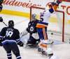 TREVOR HAGAN / WINNIPEG FREE PRESS Archives
New York Islanders' PA Parenteau (15) scores past Winnipeg Jets goaltender Ondrej Pavelec (31) Winnipeg, Tuesday. The Jets hit the road to play Minnesota, another team struggling to win games recently.