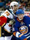 Steve Hiscock / the canadian press archives
Flames'John Armstrong battles Islanders' John Tavares in 2010 pre-season game in Saskatoon.