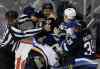 Trevor Hagan / The Canadian Press 
Winnipeg Jets' Dustin Byfuglien (33) scrums with St. Louis Blues' Scottie Upshall (10) and Jay Bouwmeester (19) as Jets' Toby Enstrom (39) looks on during third period NHL hockey action in Winnipeg Sunday.