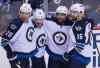 JONATHAN HAYWARD / Canadian Press files
If Bryan Little (from left), Blake Wheeler,  and Mathieu Perreault are suddenly looking at an empty stall where Andrew Ladd  used to sit, they would certainly have an internal response if the returns on the trades were not going to help the Jets today.