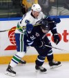 Jeff Bassett / The Canadian Press 
Vancouver Canucks' Dmitry Zhukenov (80) checks Winnipeg Jets' Nic Petan (38) during first period NHL rookie action in Penticton, B.C. on Sunday.