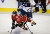 Jeff McIntosh / The Canadian Press 
Winnipeg Jets' Mark Stuart, right, knocks Calgary Flames' Johnny Gaudreau to the ice during third period NHL pre-season hockey action in Calgary Thursday, Oct. 2.