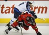 Jeff McIntosh / The Canadian Press
Winnipeg Jets Jim Slater (left) checks Calgary Flames TJ Brodie during first period NHL hockey action in Calgary Monday.