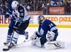 Nathan Denette / The Canadian Press
Toronto Maple Leafs goalie James Reimer (34) makes a save as he is screened by Winnipeg Jets forward Andrew Ladd (16) during the first period in Toronto on Saturday.